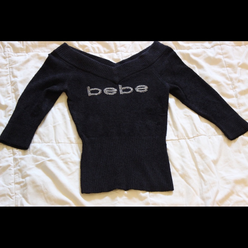 Bebe sweater with rhinestone logo.